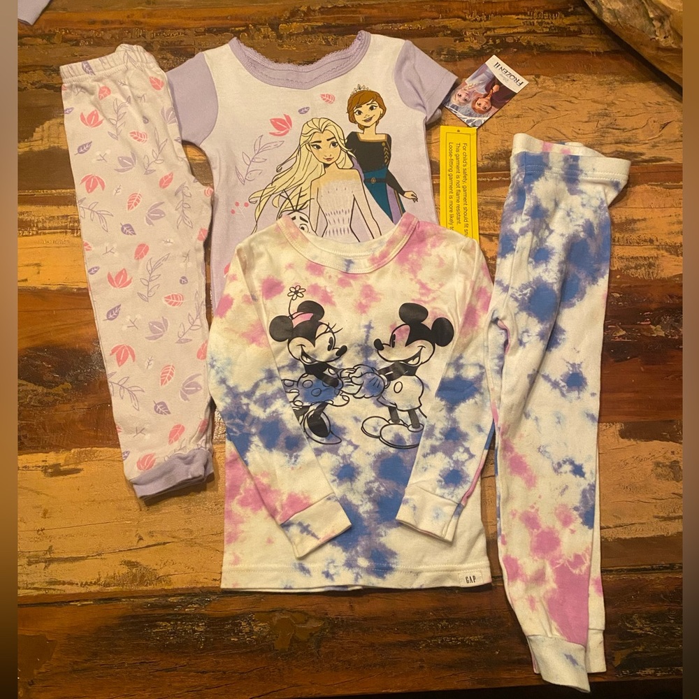 Two sets of girls 3T pajamas. Only short sleeve top has the tags still on it